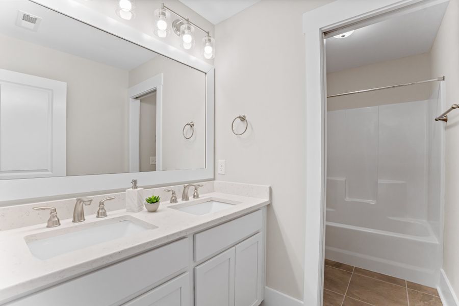 Representative furnished interior of a home built from the Hanover by Bill Clark Homes in Osprey Landing, Southport (Image 30).