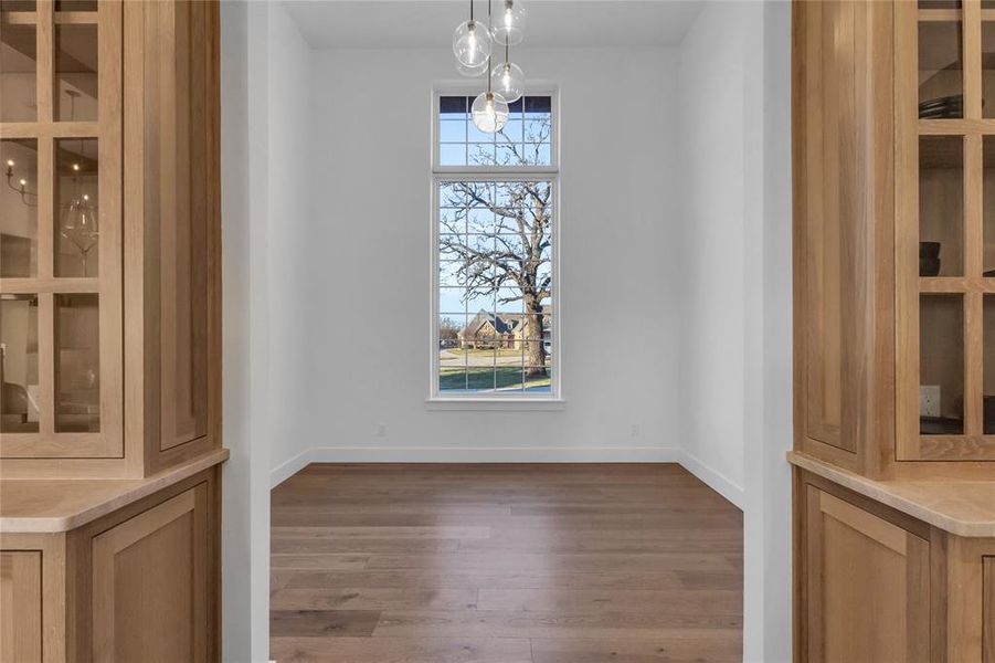 Dining room with oversized window and 16 ft ceilings