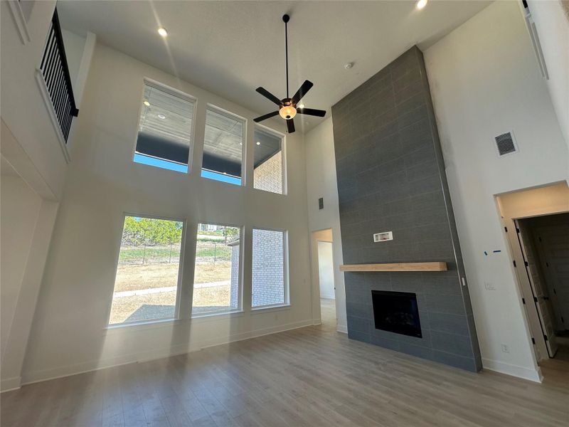 Family Room with soaring ceiling & fireplace