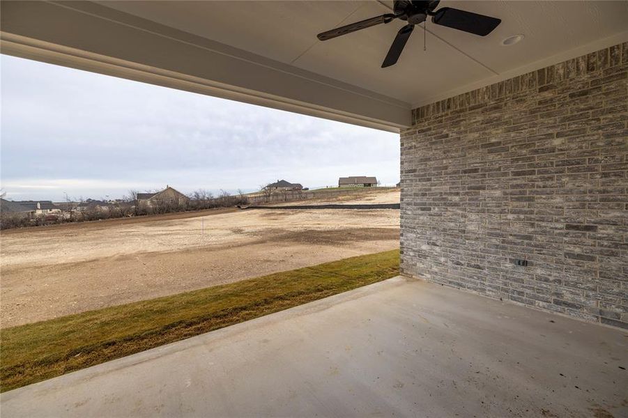 View of patio featuring ceiling fan