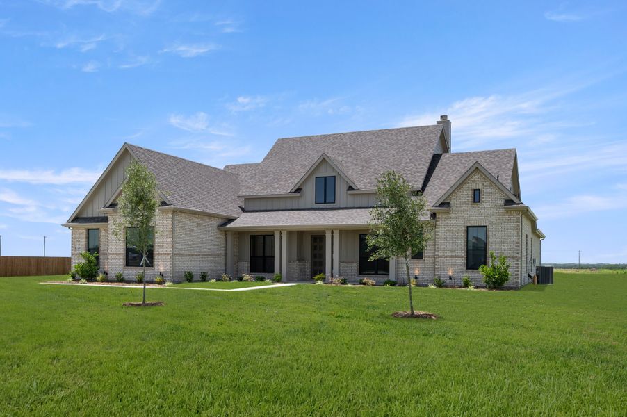 Front exterior of a new home in Hartson Estates, Midlothian, TX, highlighting curb appeal (Image 2). Front exterior of a new home in Hartson Estates, Midlothian, TX, highlighting curb appeal (Image 2).