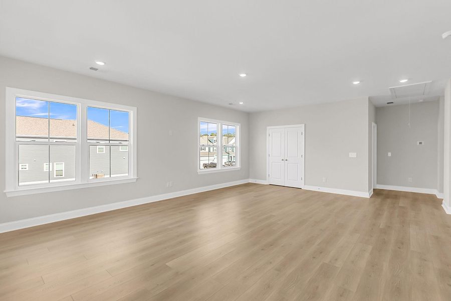 Spacious, unfurnished interior of a new home in Tidewater at Lakes of Cane Bay, Summerville (Image 28).
