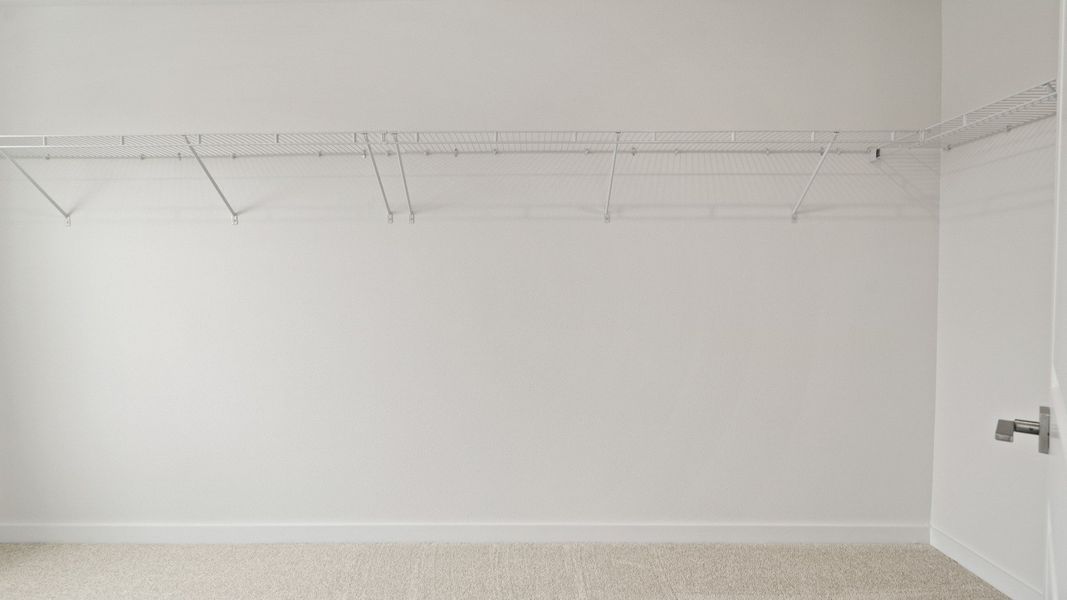 Highbourne Second Floor Primary en Suite Walk-in Closet by DRB Homes in Willowbrook North located in Winter Haven, FL. Highbourne Second Floor Primary en Suite Walk-in Closet by DRB Homes in Willowbrook North located in Winter Haven, FL.