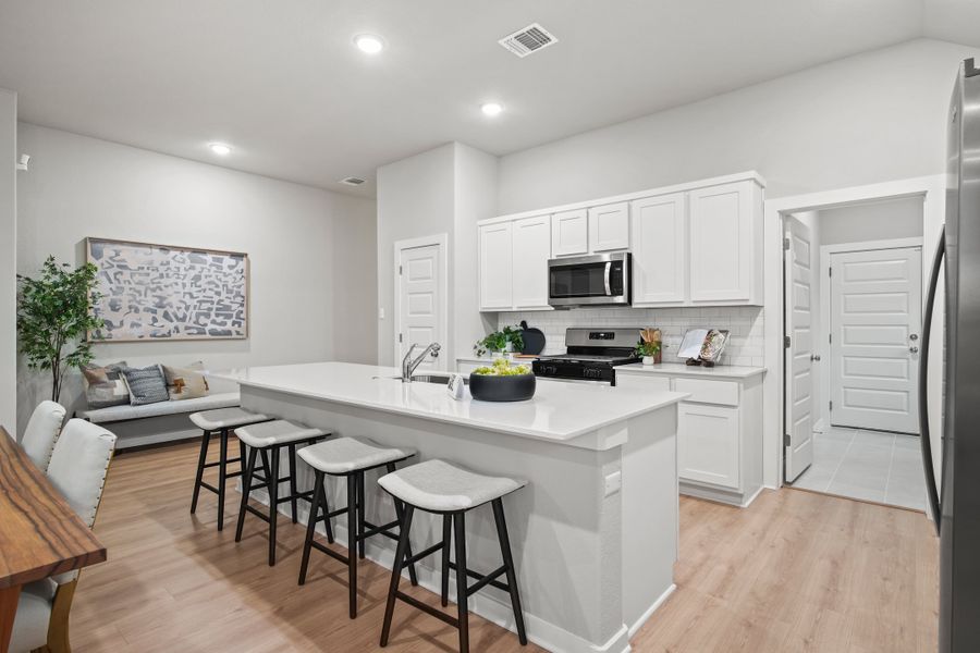 Kitchen in the Diamond home plan by Trophy Signature Homes – REPRESENTATIVE PHOTO