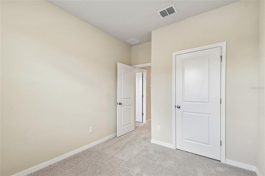 Spacious, unfurnished interior of a new home in Preserve at The Cays – The Harbor Series, Daytona Beach (Image 20). Spacious, unfurnished interior of a new home in Preserve at The Cays – The Harbor Series, Daytona Beach (Image 20).