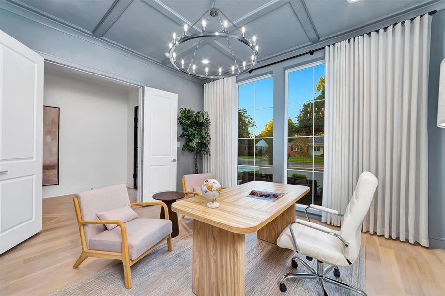 Home office with light wood finished floors, a chandelier, and coffered ceiling Home office with light wood finished floors, a chandelier, and coffered ceiling