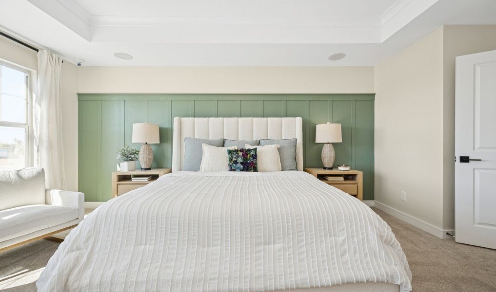 Primary suite with decorative feature wall