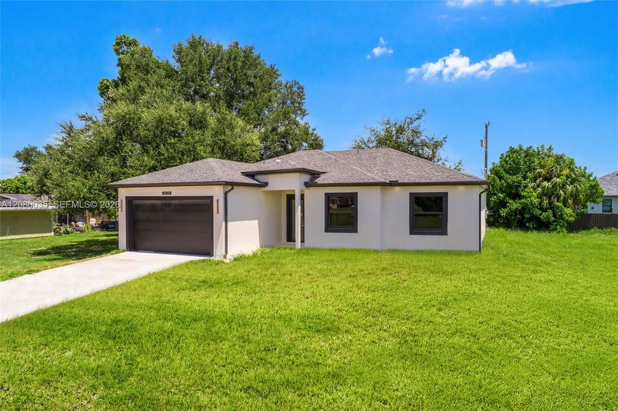 Front exterior of a new home in , Cape Coral, FL, highlighting curb appeal (Image 2). Front exterior of a new home in , Cape Coral, FL, highlighting curb appeal (Image 2).