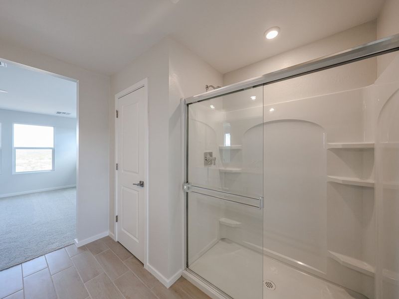 A bathroom with a glass shower.