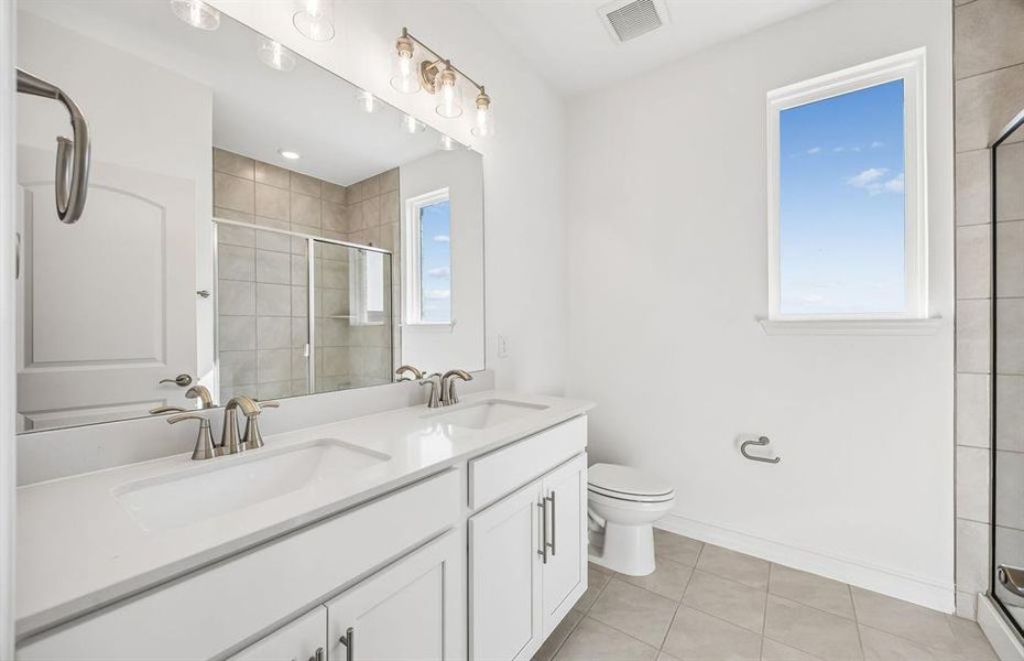 Secondary bathroom with double vanity Secondary bathroom with double vanity