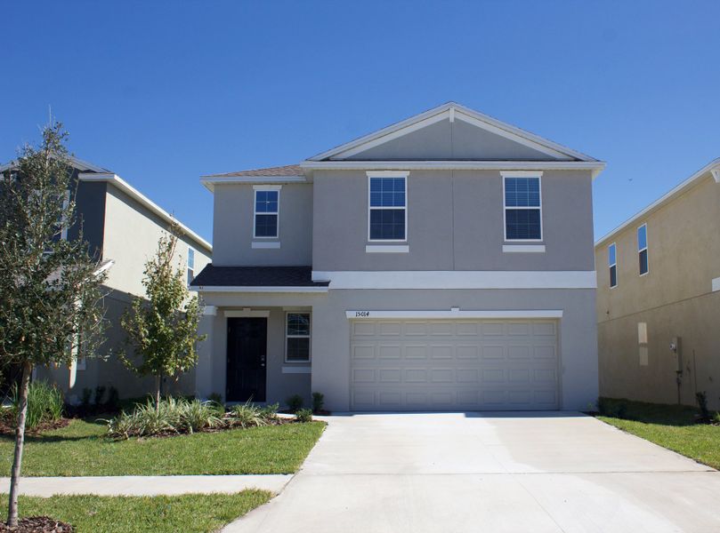 Front exterior of a new home in Balm Grove: The Manors East, Wimauma, FL, highlighting curb appeal (Image 1). Front exterior of a new home in Balm Grove: The Manors East, Wimauma, FL, highlighting curb appeal (Image 1).