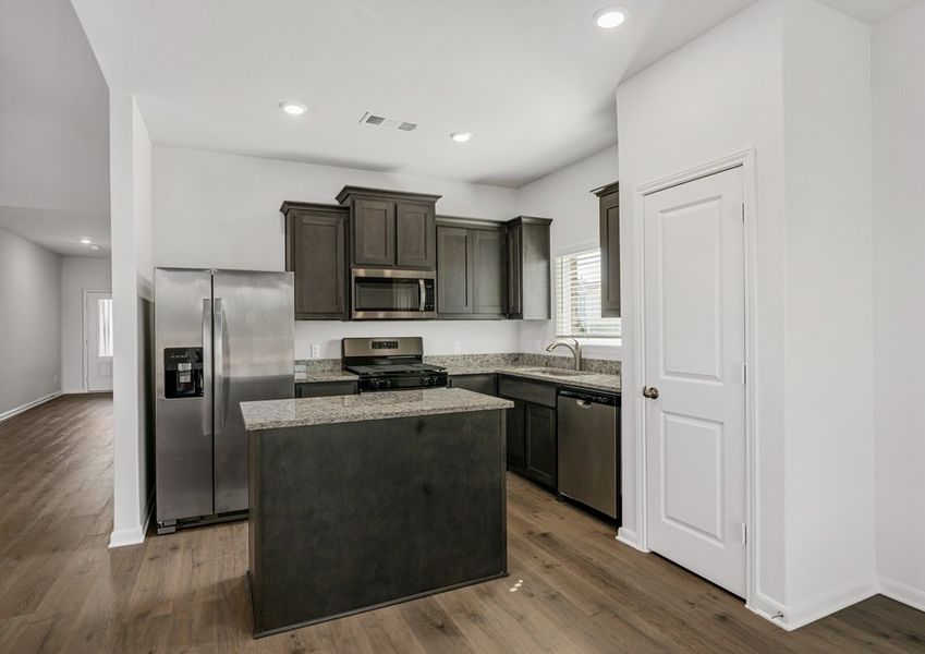 The kitchen has sprawling granite countertops.