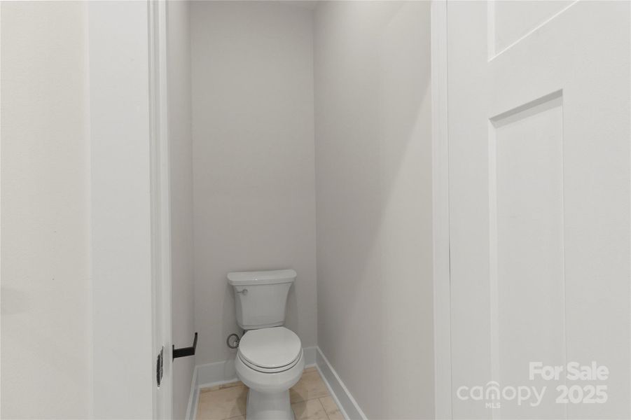 Primary bathroom water closet. Privacy for toilet use