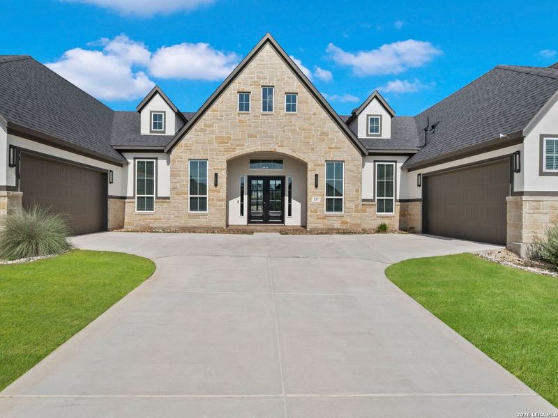 Front exterior of a new home in Potranco Oaks 100's, Castroville, TX, highlighting curb appeal (Image 2). Front exterior of a new home in Potranco Oaks 100's, Castroville, TX, highlighting curb appeal (Image 2).