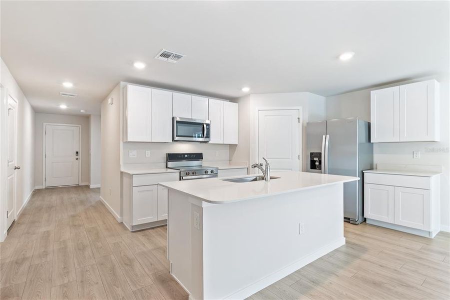 Furnished interior view inside a new home in Central Parc, North Port (Image 6).