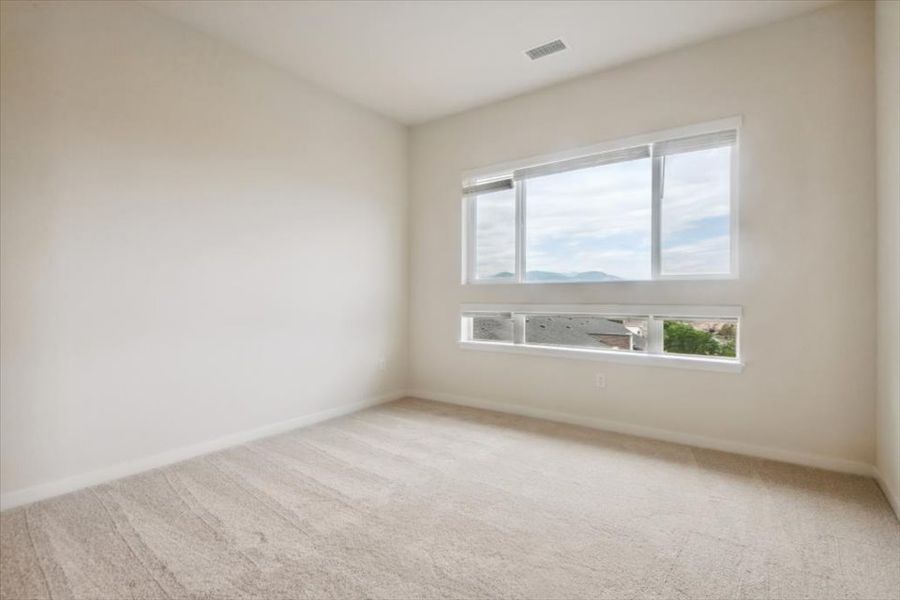 A room with a window and a plant in it. A room with a window and a plant in it.