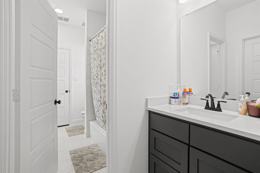 Secondary bath with contemporary finishes