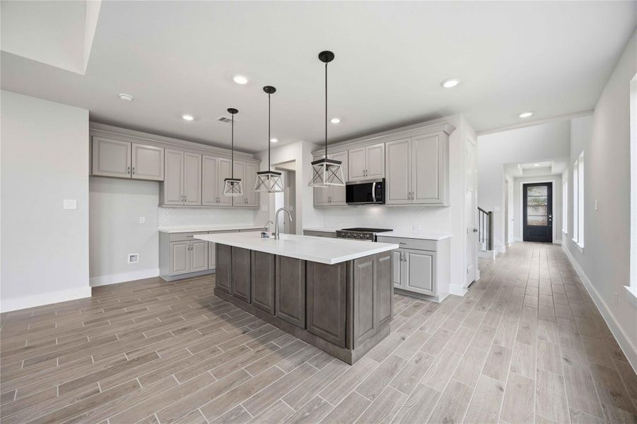 Furnished interior view inside a new home in Ellwood, Iowa Colony (Image 10).