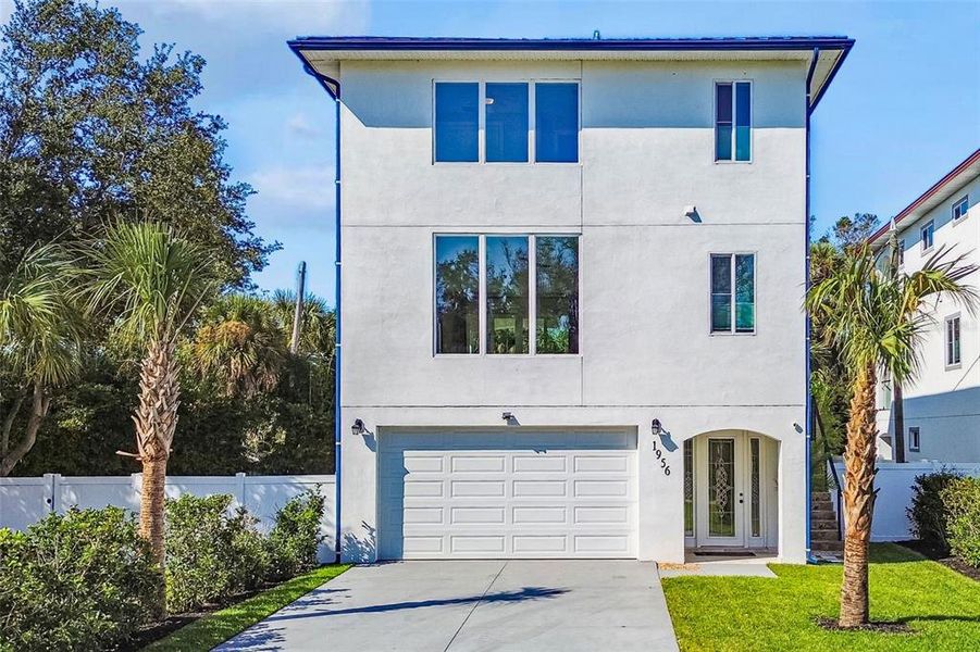 Front exterior of a new home in , Dunedin, FL, highlighting curb appeal (Image 2).