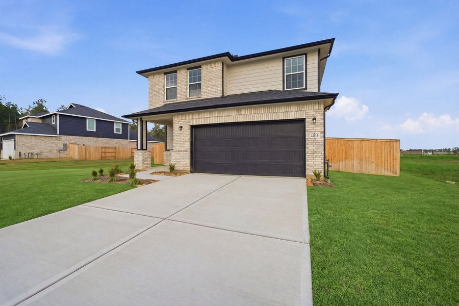 Front exterior of a new home in The Canopies, Splendora, TX, highlighting curb appeal (Image 28).