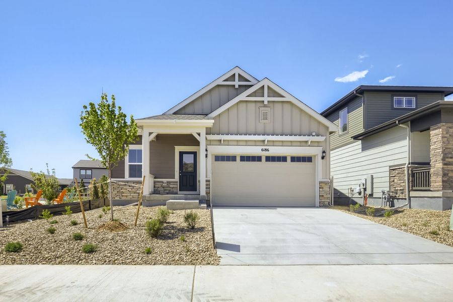 Front exterior of a new home in Kinston, Loveland, CO, highlighting curb appeal (Image 1). Front exterior of a new home in Kinston, Loveland, CO, highlighting curb appeal (Image 1).