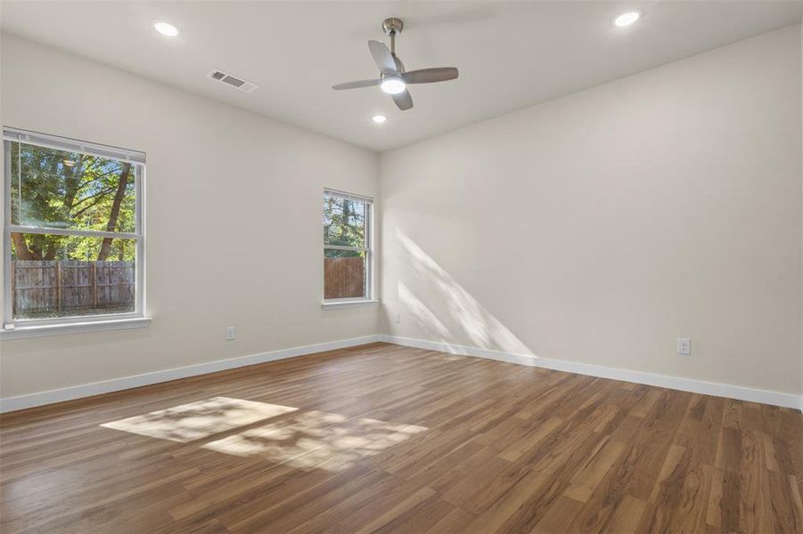 Spare room with wood finished floors, recessed lighting, and ceiling fan Spare room with wood finished floors, recessed lighting, and ceiling fan