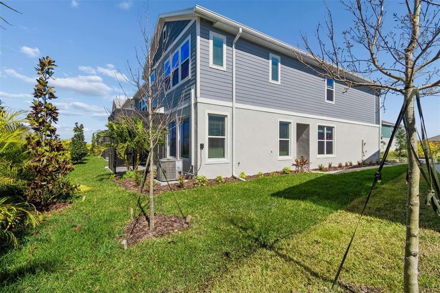 Exterior details and patio area of a home in North River Ranch – Townhomes, Parrish (Image 27).