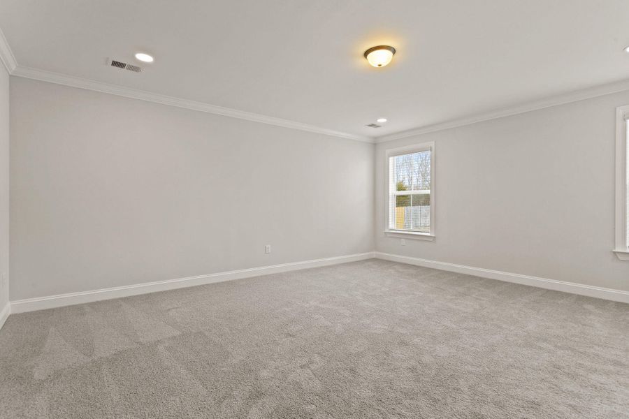 Spacious, unfurnished interior of a new home in Tidewater at Lakes of Cane Bay, Summerville (Image 24).