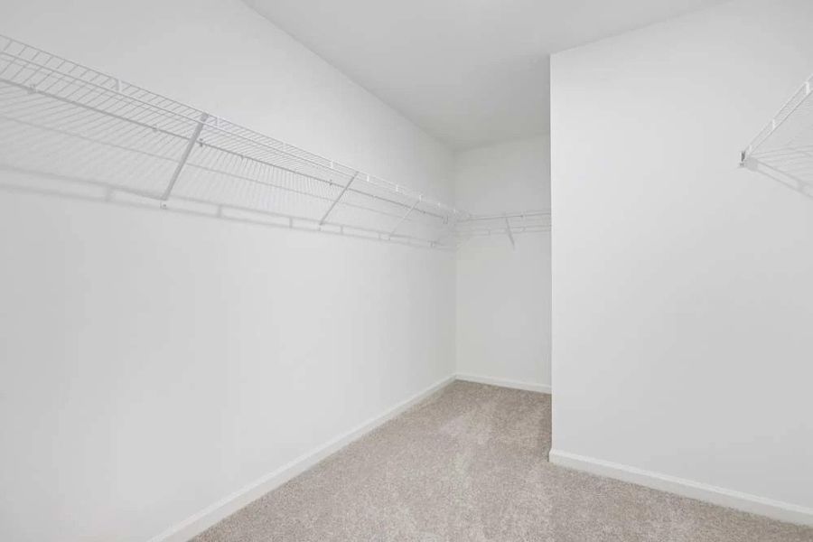 Sample Photo: Primary Bedroom Walk-In Closet Sample Photo: Primary Bedroom Walk-In Closet