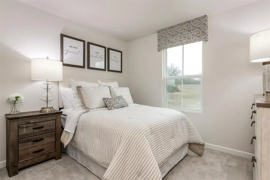 Representative furnished interior of a home built from the Tate by Ryan Homes in Middle Creek Village Coastal Cottages & Villas, Bolivia (Image 23).