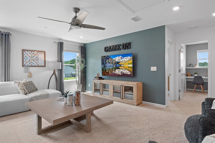 A living room with a blue wall.
