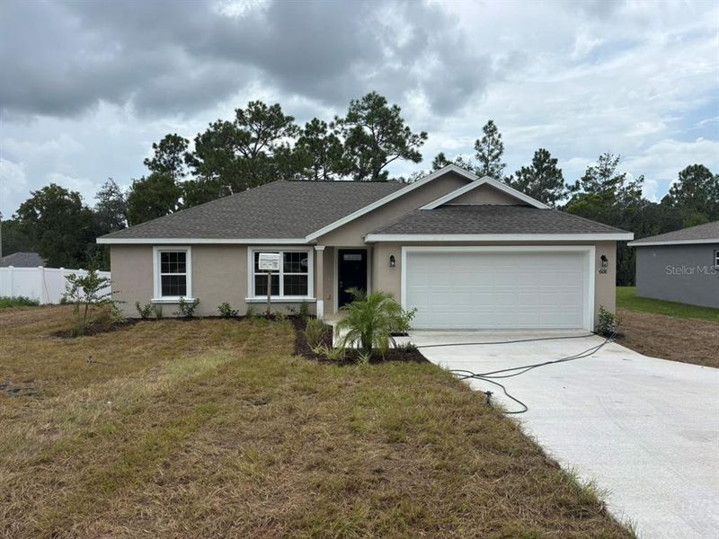 Front exterior of a new home in , Dunnellon, FL, highlighting curb appeal (Image 1). Front exterior of a new home in , Dunnellon, FL, highlighting curb appeal (Image 1).