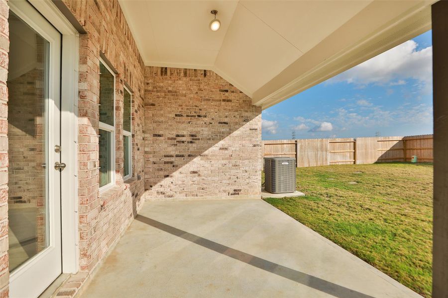 Exterior details and patio area of a home in Creekhaven, Iowa Colony (Image 3). Exterior details and patio area of a home in Creekhaven, Iowa Colony (Image 3).