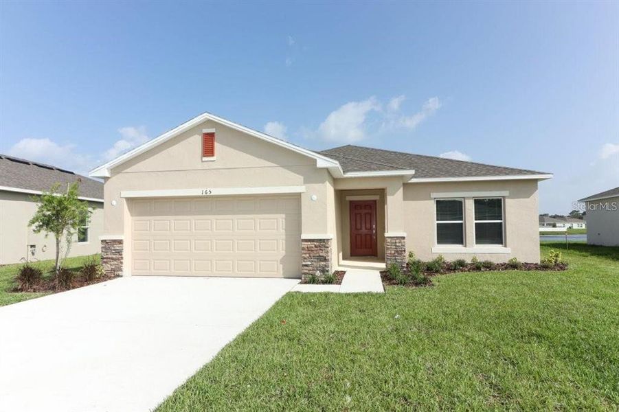 Front exterior of a new home in , Kissimmee, FL, highlighting curb appeal (Image 1).