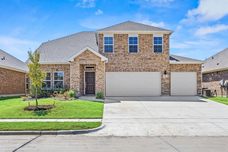 Front exterior of a new home in Prestige Collection at Overland Grove, Forney, TX, highlighting curb appeal (Image 12). Front exterior of a new home in Prestige Collection at Overland Grove, Forney, TX, highlighting curb appeal (Image 12).