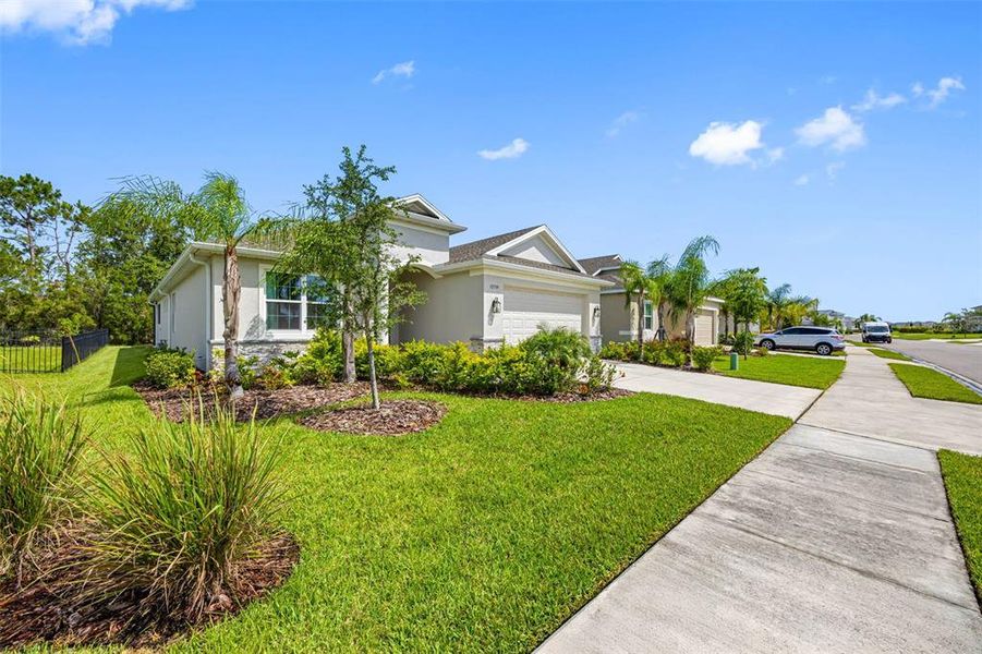 Front exterior of a new home in , Parrish, FL, highlighting curb appeal (Image 2).