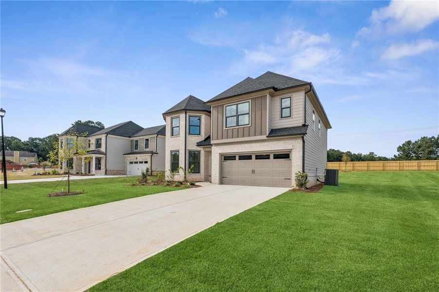 Front exterior of a new home in , Lawrenceville, GA, highlighting curb appeal (Image 25).