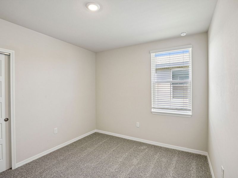 Spacious, unfurnished interior of a new home in Crescent Lakes - Premier Series, Punta Gorda (Image 16).