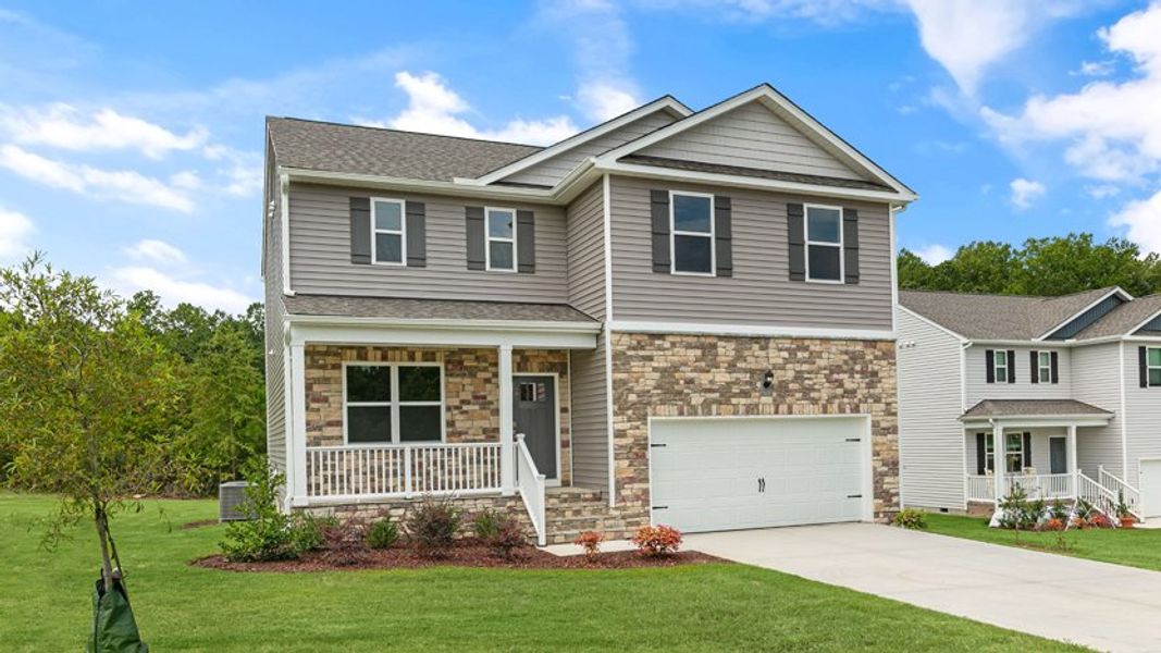 Front exterior of a new home in Baker Farm, Youngsville, NC, highlighting curb appeal (Image 17).