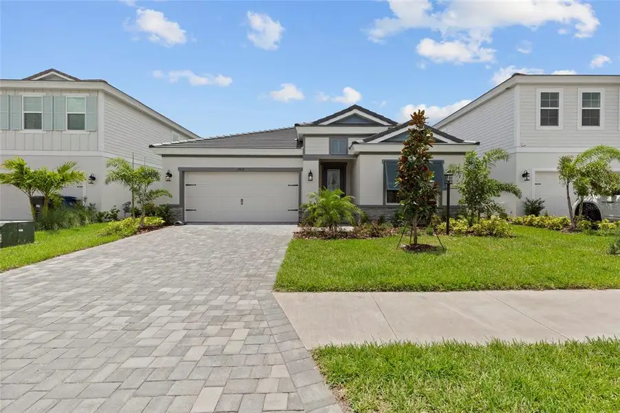 Front exterior of a new home in , Bradenton, FL, highlighting curb appeal (Image 2). Front exterior of a new home in , Bradenton, FL, highlighting curb appeal (Image 2).