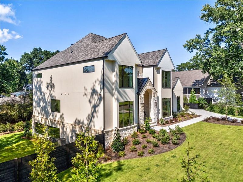 Front exterior of a new home in , Alpharetta, GA, highlighting curb appeal (Image 31). Front exterior of a new home in , Alpharetta, GA, highlighting curb appeal (Image 31).
