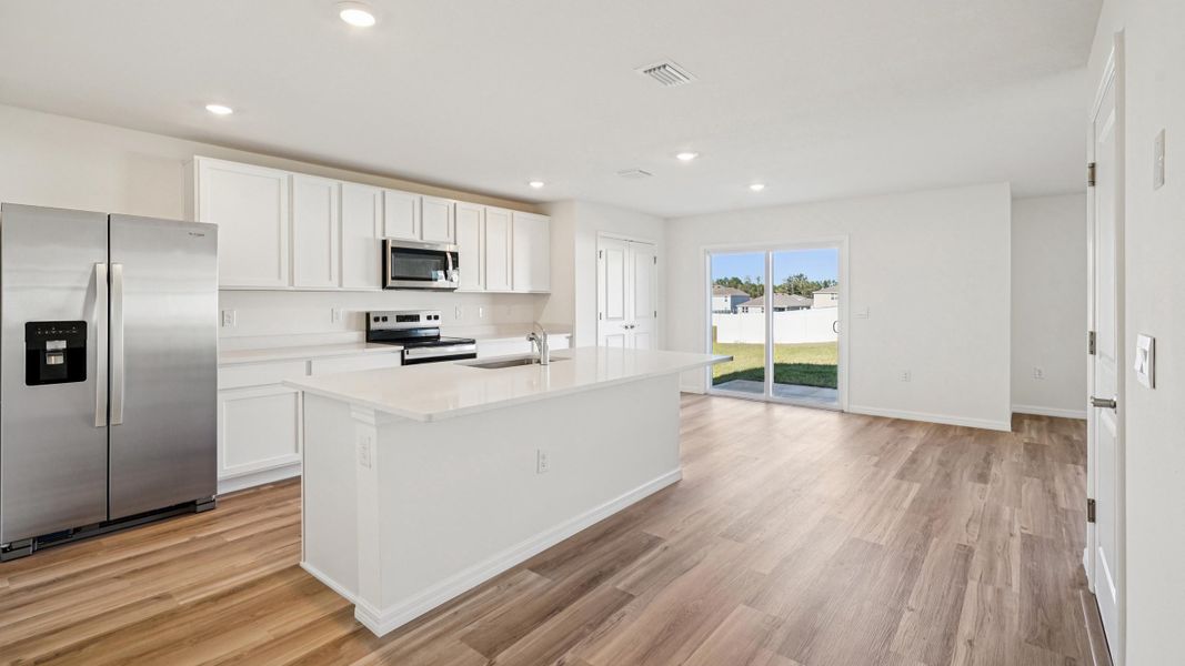 Representative furnished interior of a home built from the Ensley by D.R. Horton in Sandal Key, Weeki Wachee (Image 14).