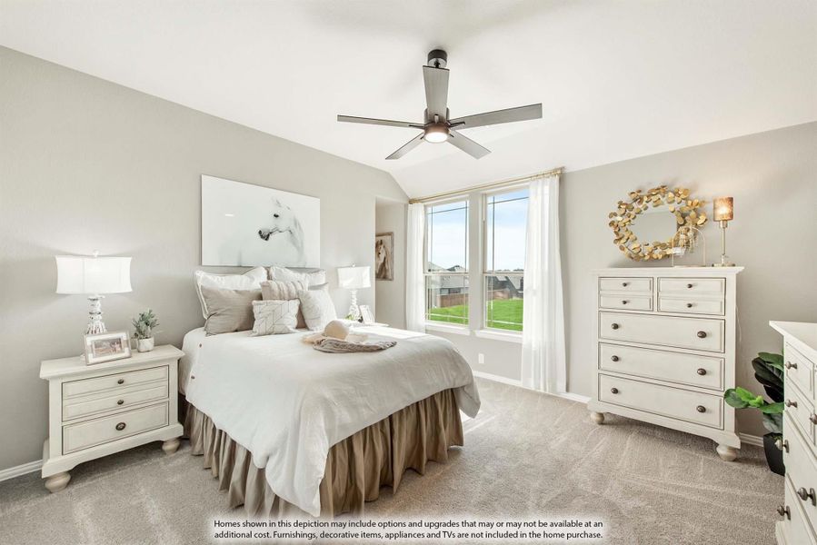 Bedroom with vaulted ceiling, ceiling fan, carpet flooring, white dresser, and large window with natural light.