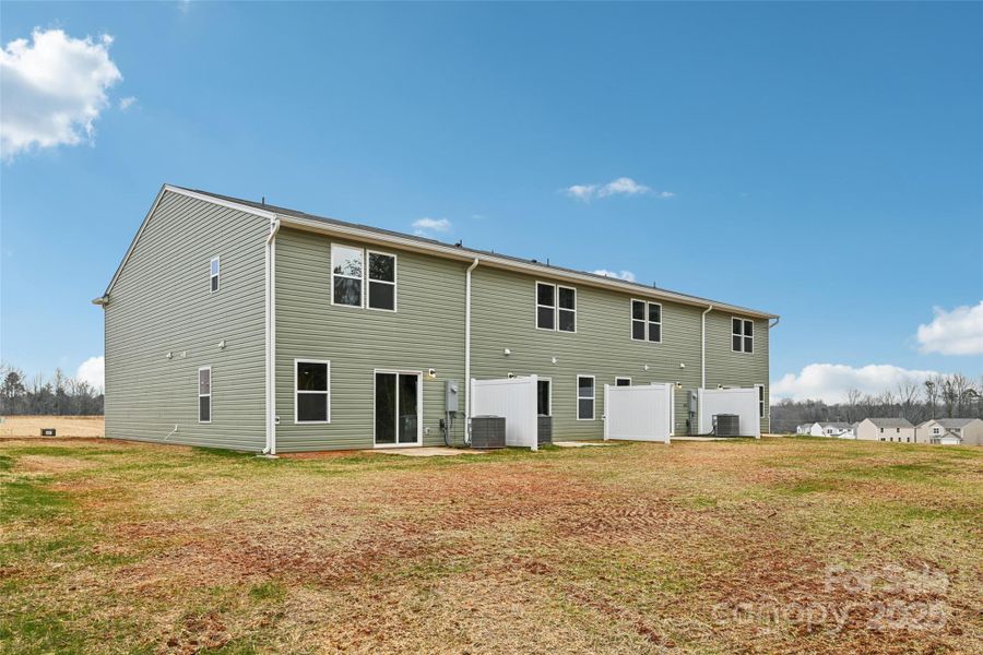 Exterior details and patio area of a home in The Towns at Green Needles, Lexington (Image 13).