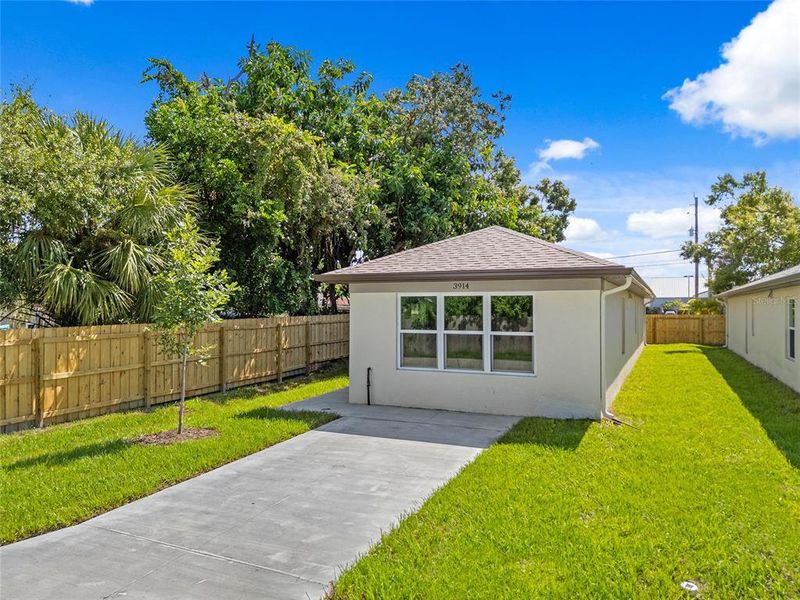 Front exterior of a new home in , Sarasota, FL, highlighting curb appeal (Image 19).