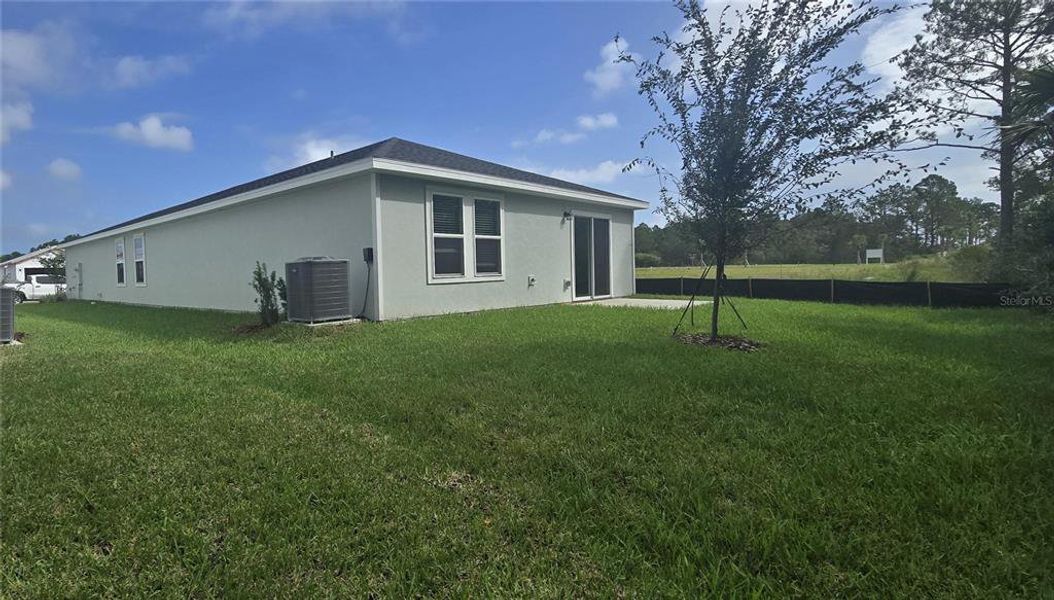 Exterior details and patio area of a home in Flagler Village - Classic Series, Palm Coast (Image 2).