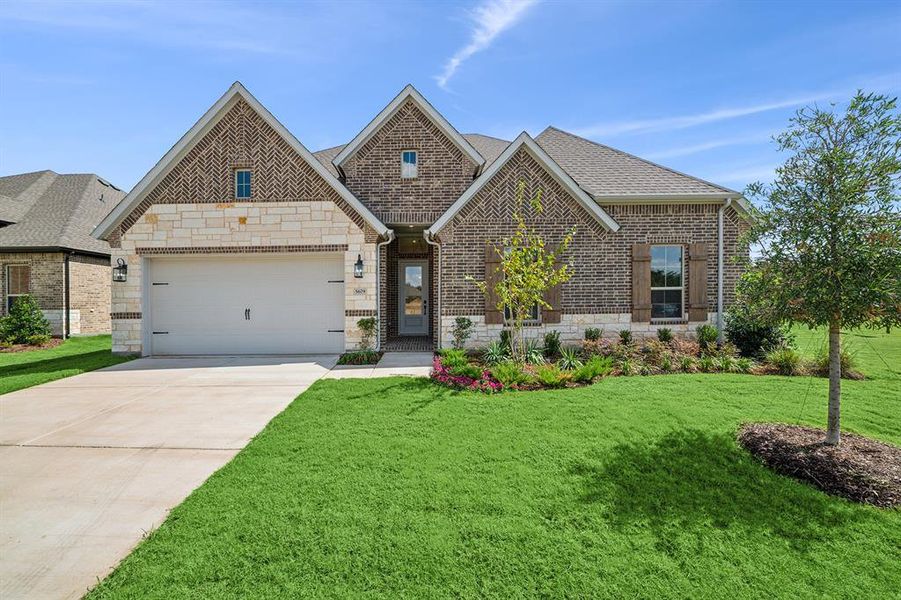 Front exterior of a new home in Sterling Greene, Arlington, TX, highlighting curb appeal (Image 1). Front exterior of a new home in Sterling Greene, Arlington, TX, highlighting curb appeal (Image 1).