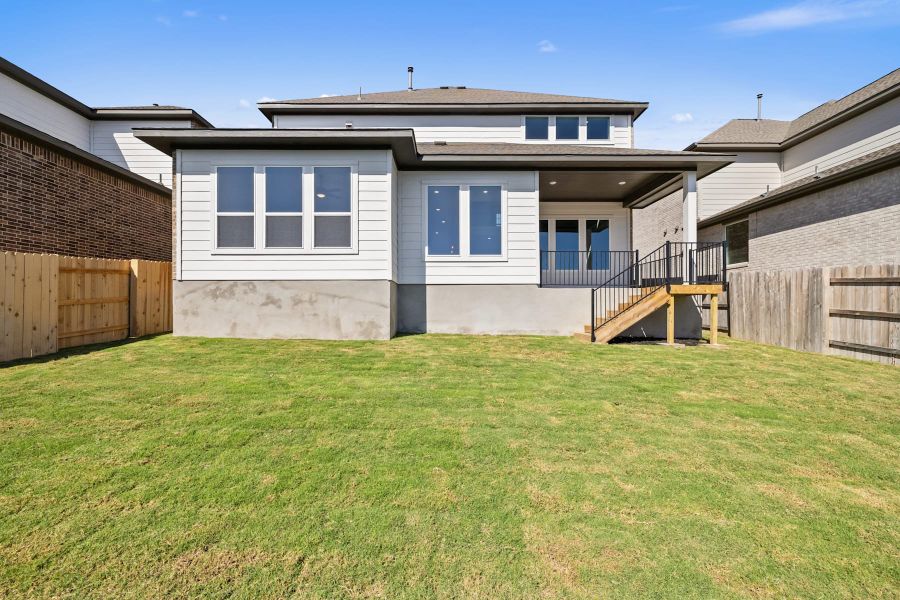 Exterior details and patio area of a home in Lariat, Liberty Hill (Image 28).