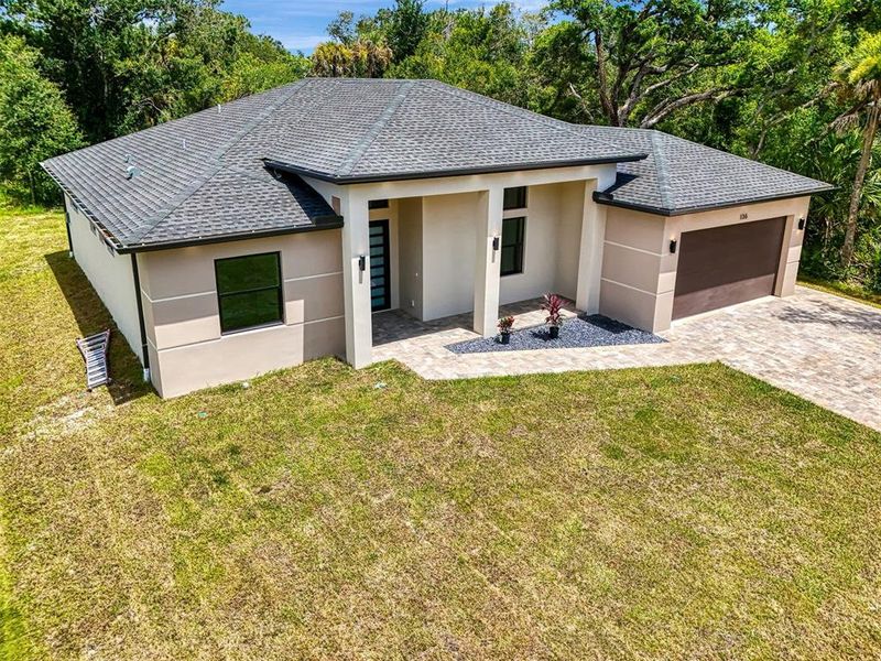 Front exterior of a new home in , Port Charlotte, FL, highlighting curb appeal (Image 26).