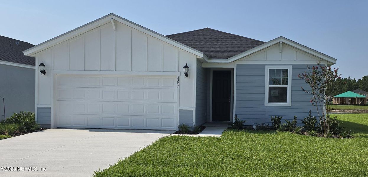 Front exterior of a new home in Lakes at Bella Lago - Signature Series, Green Cove Springs, FL, highlighting curb appeal (Image 19).